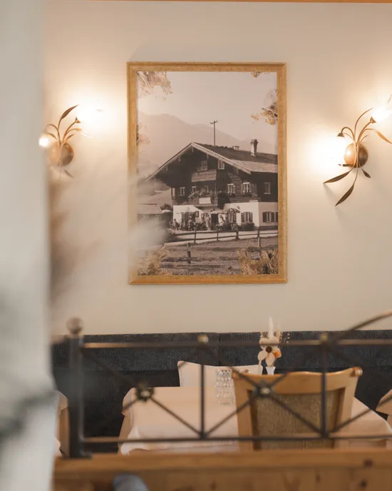 Sepia photo of house in rustic dining area with wooden decor