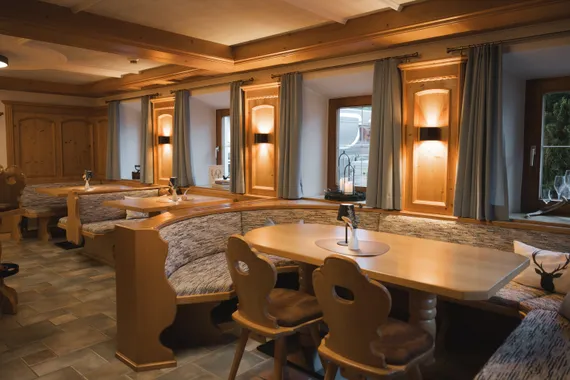 Cozy restaurant interior with wooden furniture and soft lighting