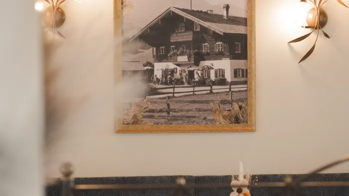 Sepia photo of house in rustic dining area with wooden decor